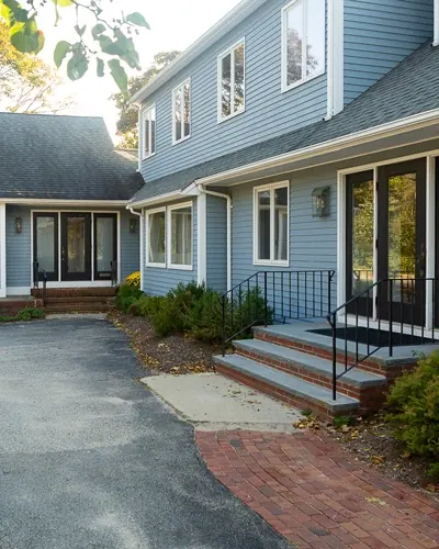 The Hingham Dental Associates building at 20 Downer Avenue, with its front steps and drive.