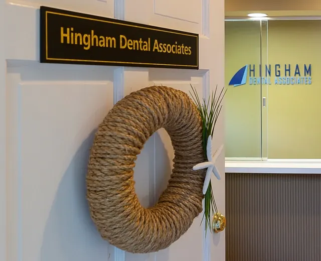 The Hingham Dental Associates name plaque and a rope wreath at the reception.